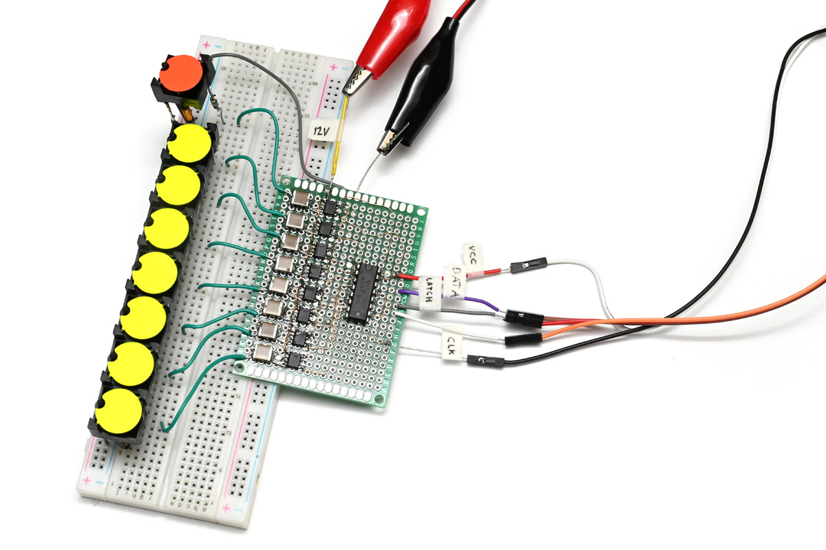 Prototype dots on a breadboard with protoboard shift register and H-bridge chips driving it