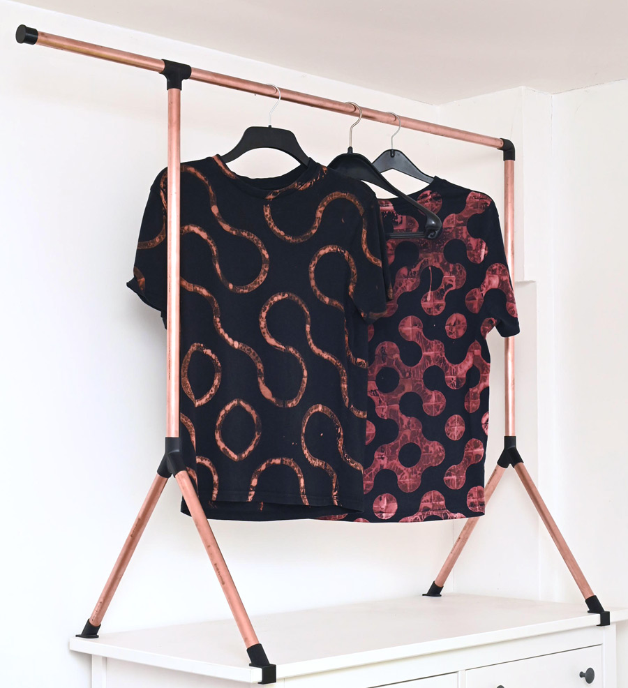 Full view with two t-shirts hanging on it