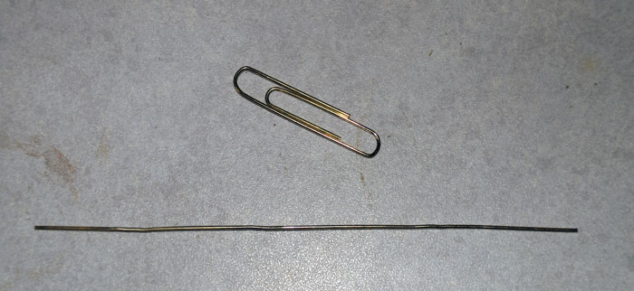 A paperclip, and a straightened paperclip