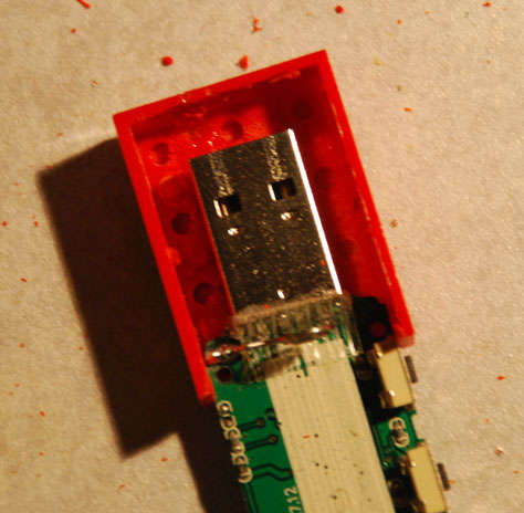 The circuit board trimmed enough to fit within the Lego enclosure