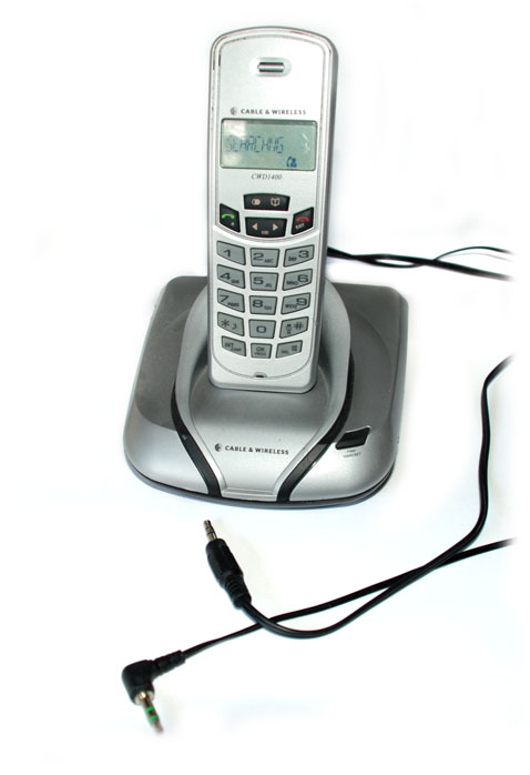 The wireless phone, with audio cables coming out of the base station