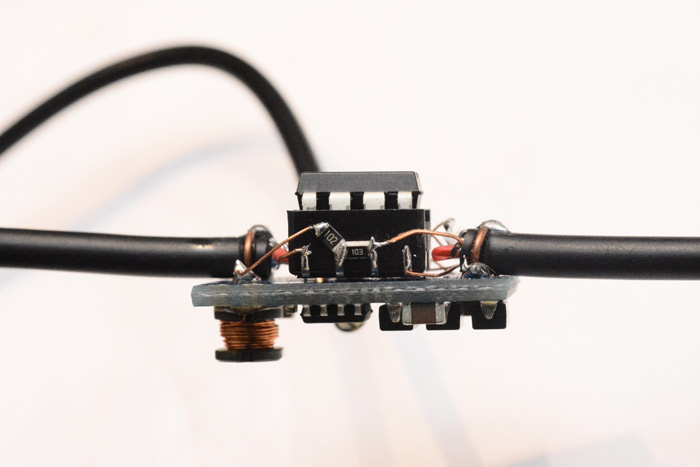 Side view of the inline circuit, with surface mount LEDs hand soldered in point-to-point fashion