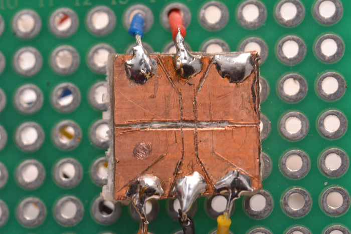 Scored copper clad board makes a simple programming jig