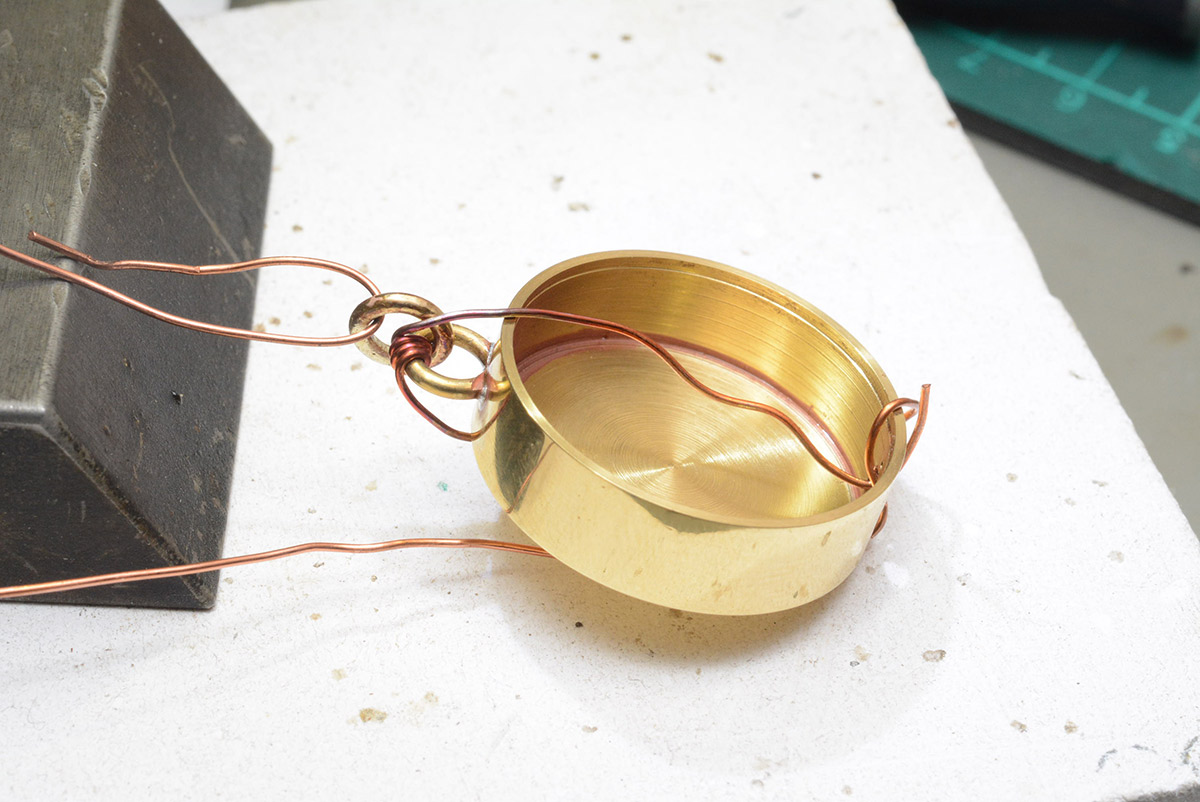 Jump ring soldered, held in place by thin copper wire