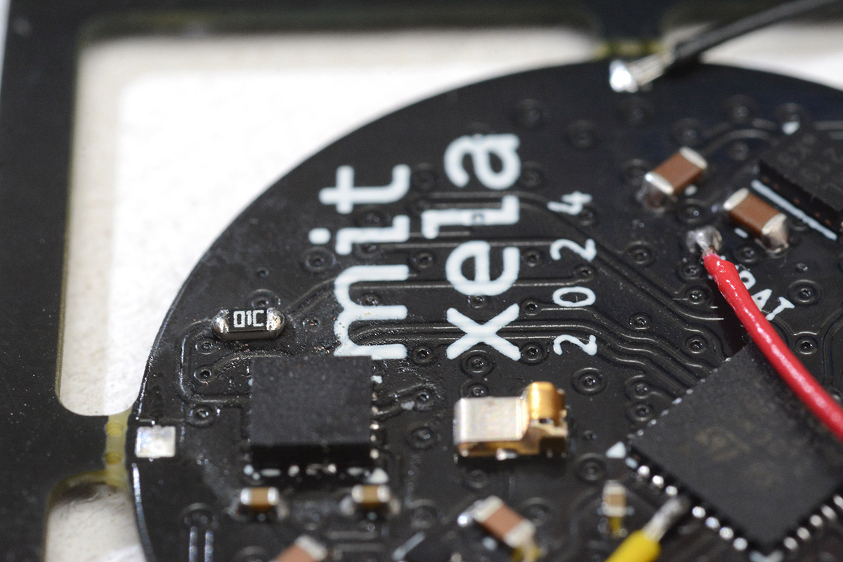 Resistor bodged onto the wakeup line from the accelerometer