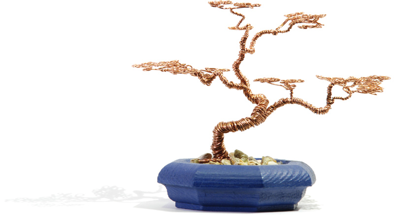 The metal bonsai, in its pot