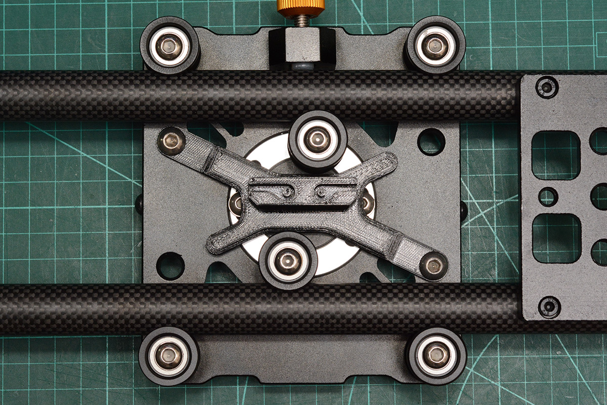 Belt clamp fitted to underside of carriage