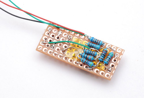 Densely packed resistors on the back of the buttons board
