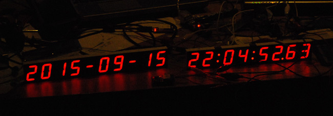 Two halves of the clock wired up and showing the date and time