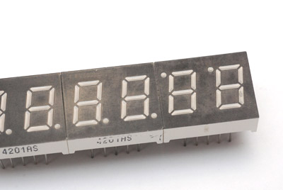 7-segment displays arranged to try and make colon indicators from the decimal points