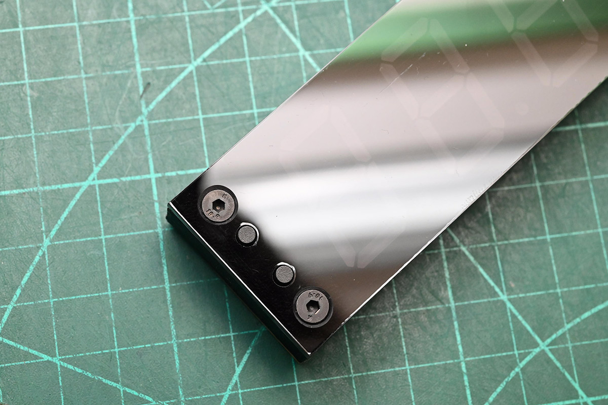 Acrylic fitted over switches with countersunk bolts