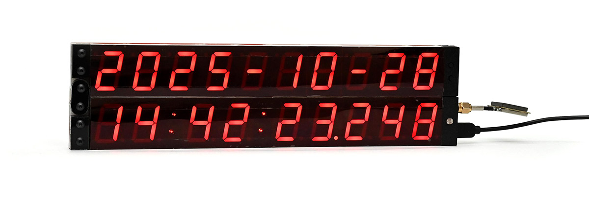 Precision clock with stage lighting gel carefully taped over the displays