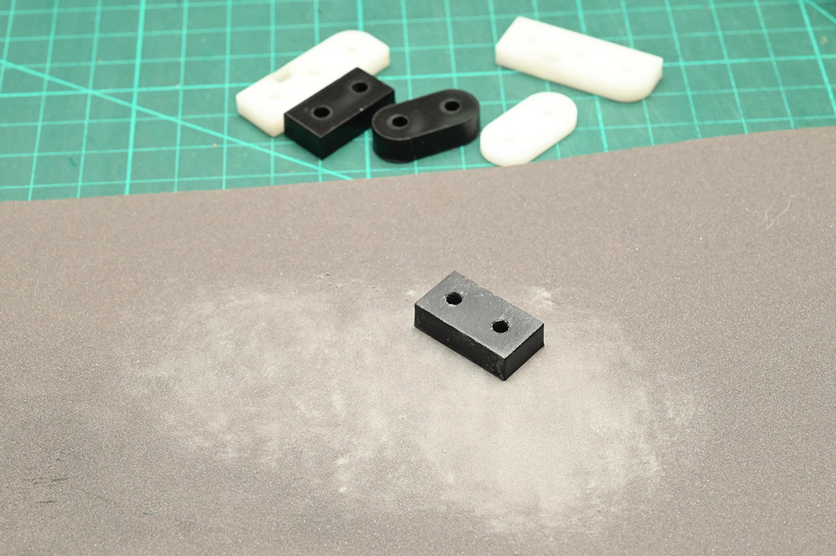 Sanding a piece of delrin