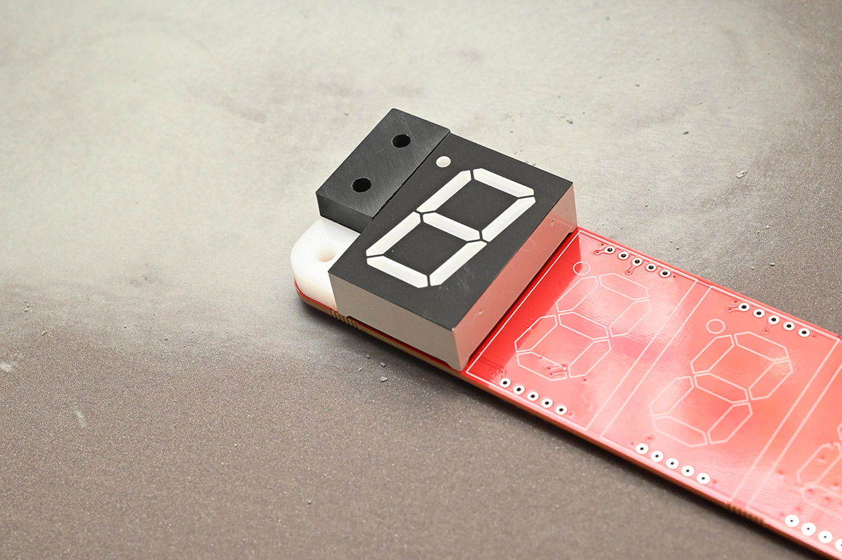 Checking the sanding progress with a test fit of a digit