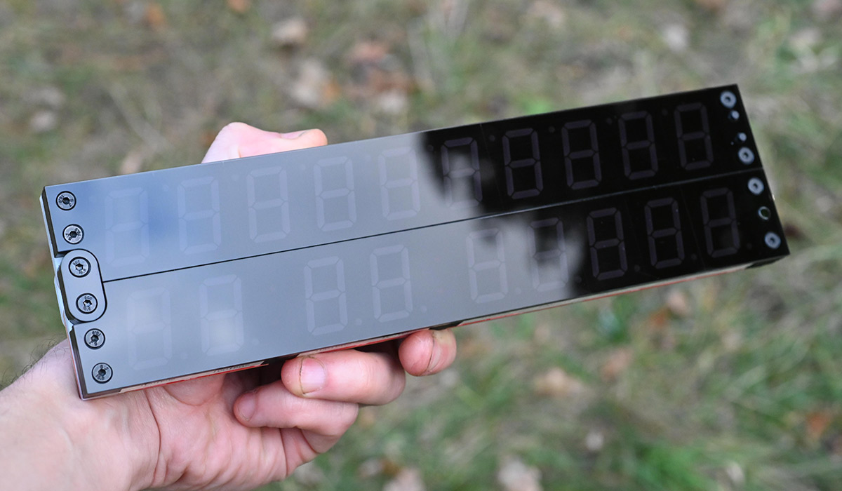 Smoked acrylic clock, handheld, outside