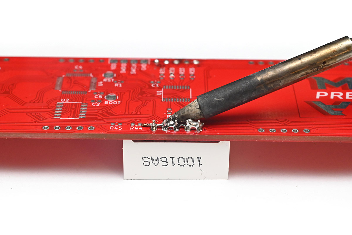 Soldering iron making good contact with the solder and wire