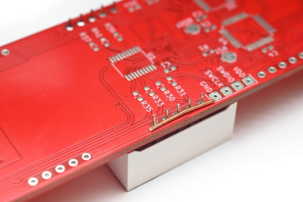 Copper wire cut to fit across the pins