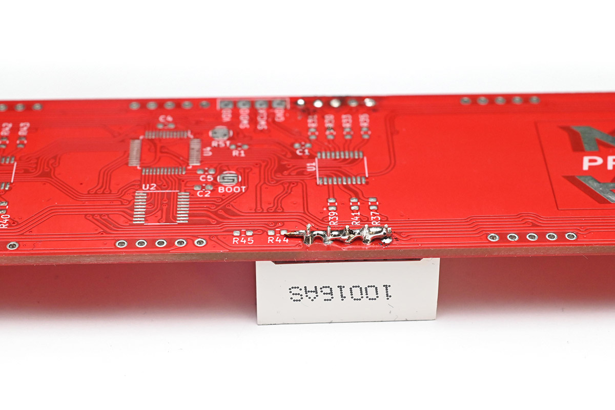 Wire flooded with solder in contact with the five remaining pins