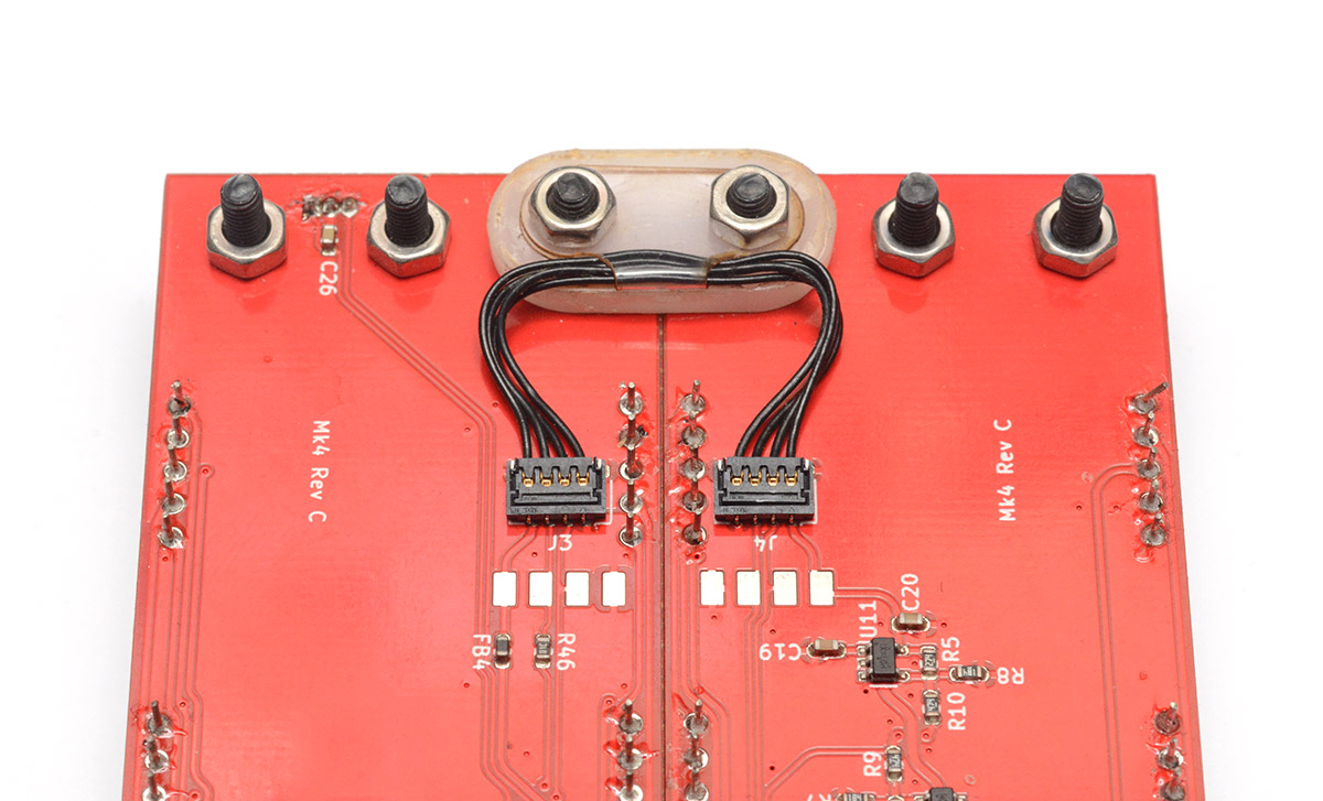 The board-to-board cable across the hinge on the Rev C clock