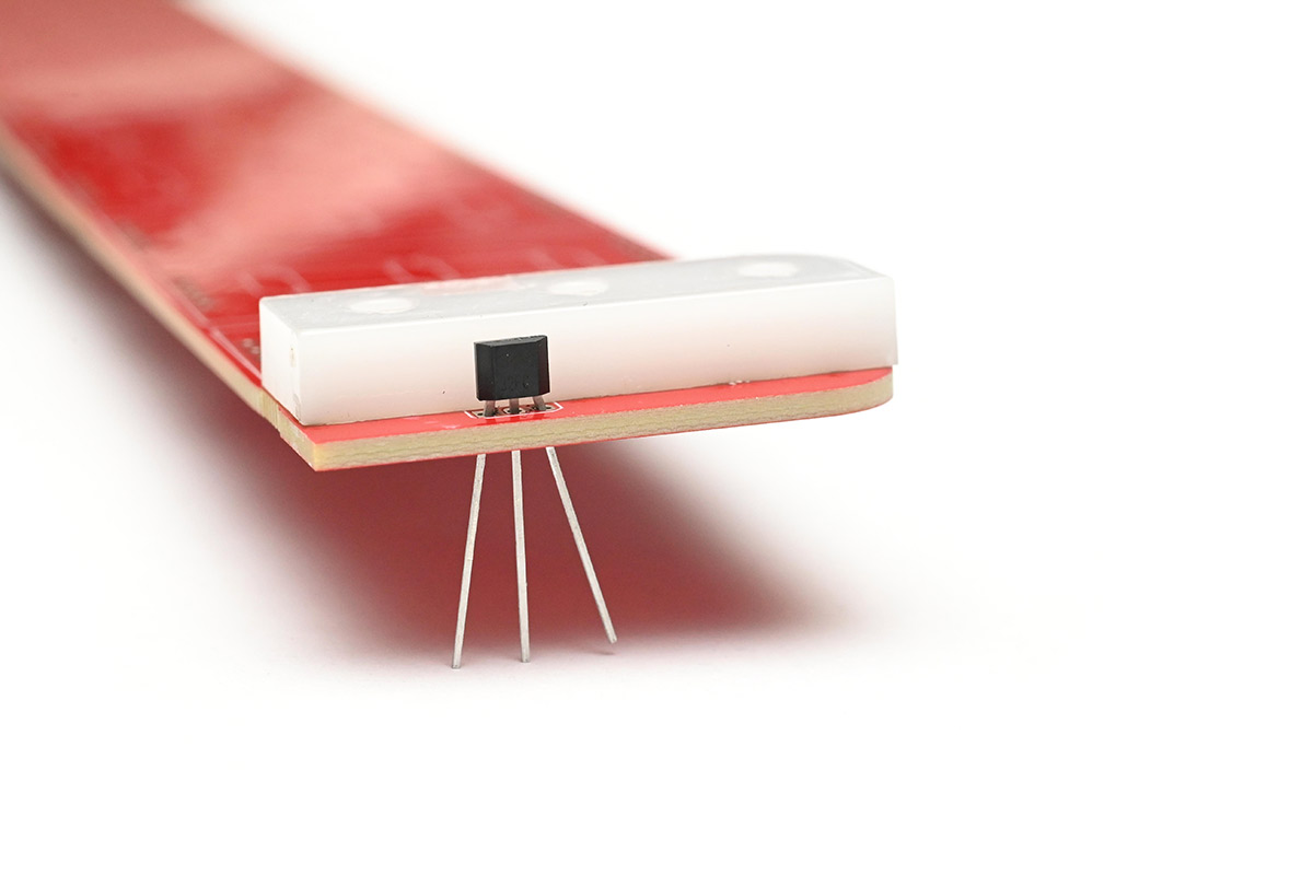 Hall sensor on Rev D board, with laser-cut 5mm delrin used to judge height
