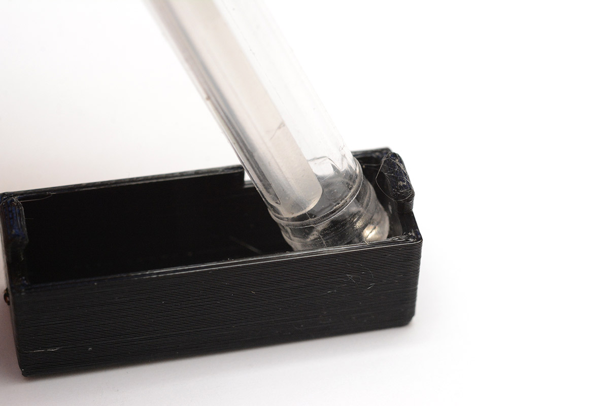 Back of ballpoint pen used to seat the magnet