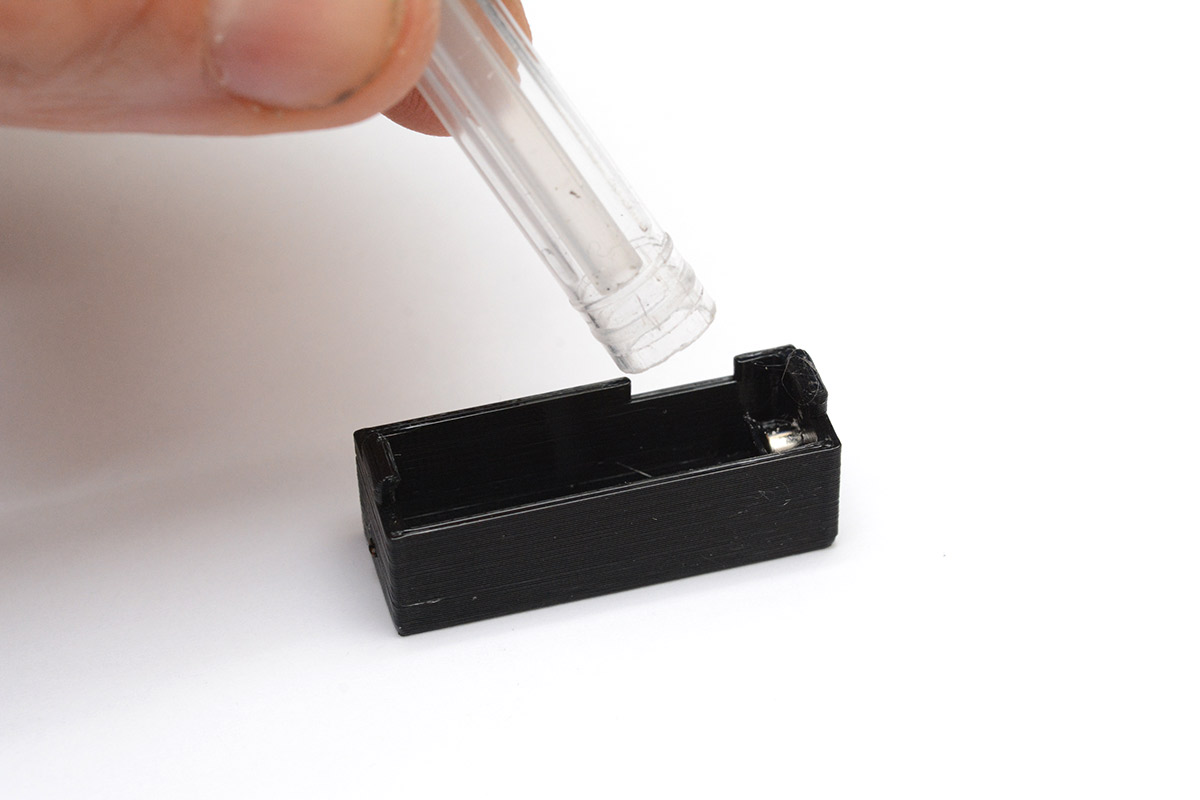 Back of ballpoint pen used to seat the magnet