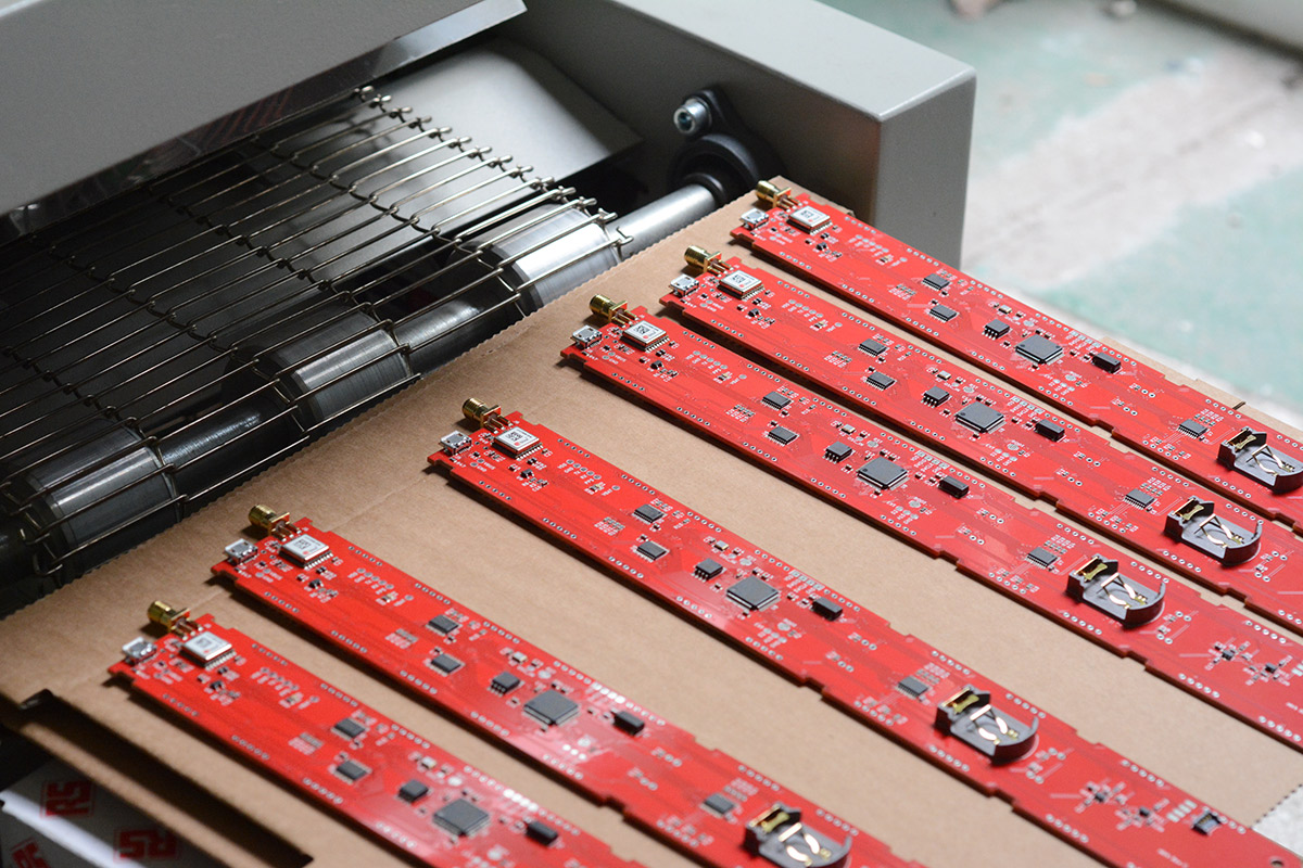 A batch of PCBs cooling down after reflow