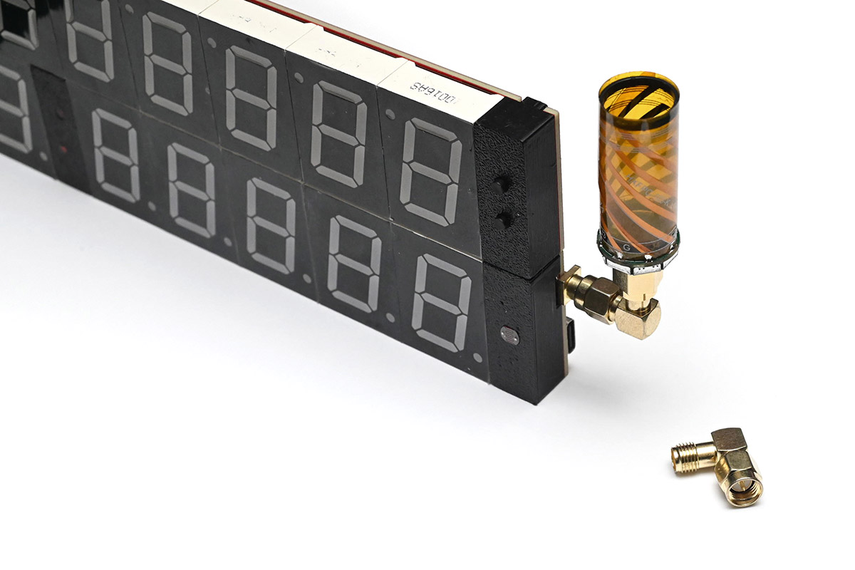 Helical antenna without case, fitted to the clock using a right angle SMA adapter