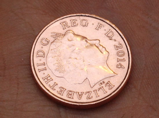Catching the light on the coin to highlight the rim