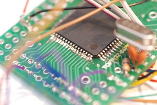 Closeup of the legs of the ATmega chip