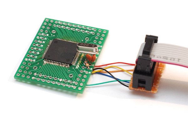 ATmega chip on its breakout board being talked to via the ISP connector