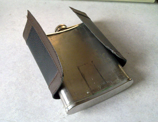 Hip flask with cover removed and cutout marked