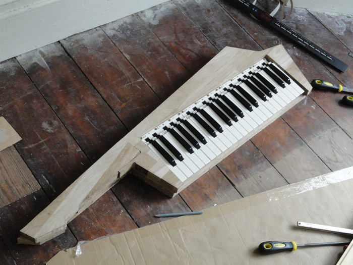 The keyboard in place within the wooden body