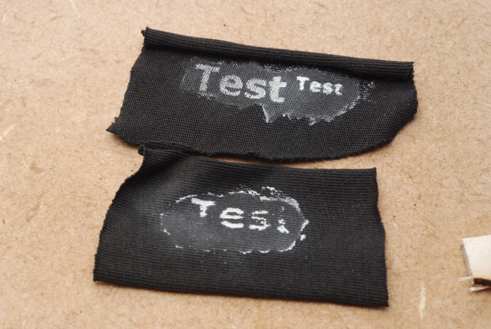 The word test, etched into strips of fabric, a very splodgy result