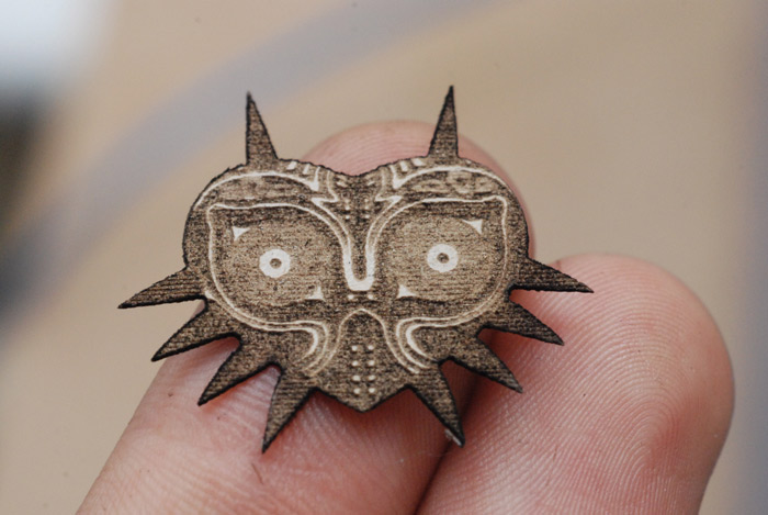 Laser etched Majora's Mask emblem in cardboard