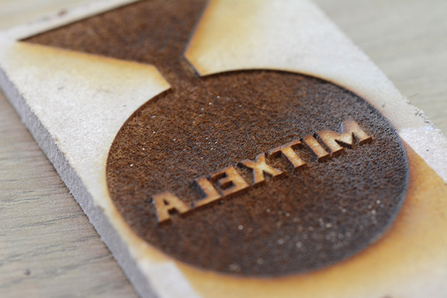 Laser etched mitxela logo in the MDF, mirrored