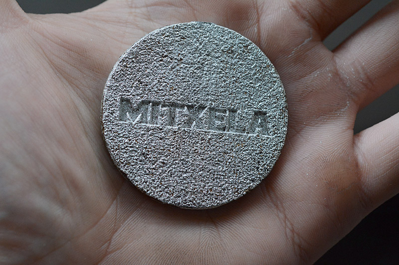 Coarse texture on the mitxela logo in the medalion