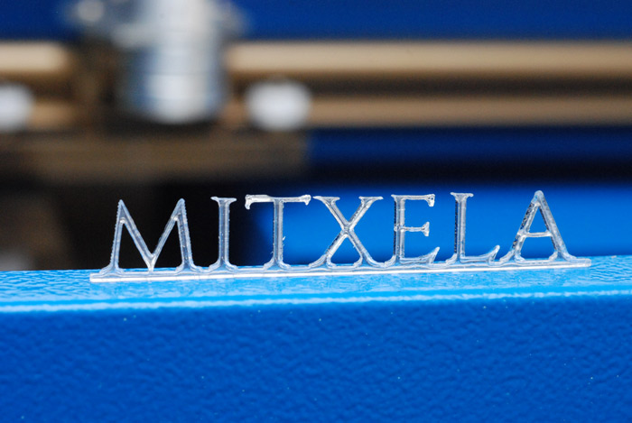 Mitxela text, laser cut in thin acrylic