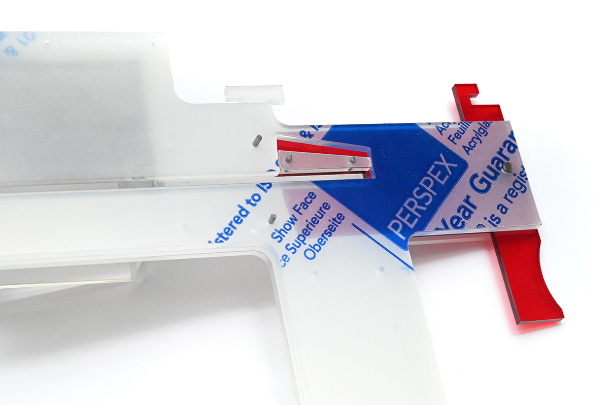 Close view of screw dispensing mechanism, closed