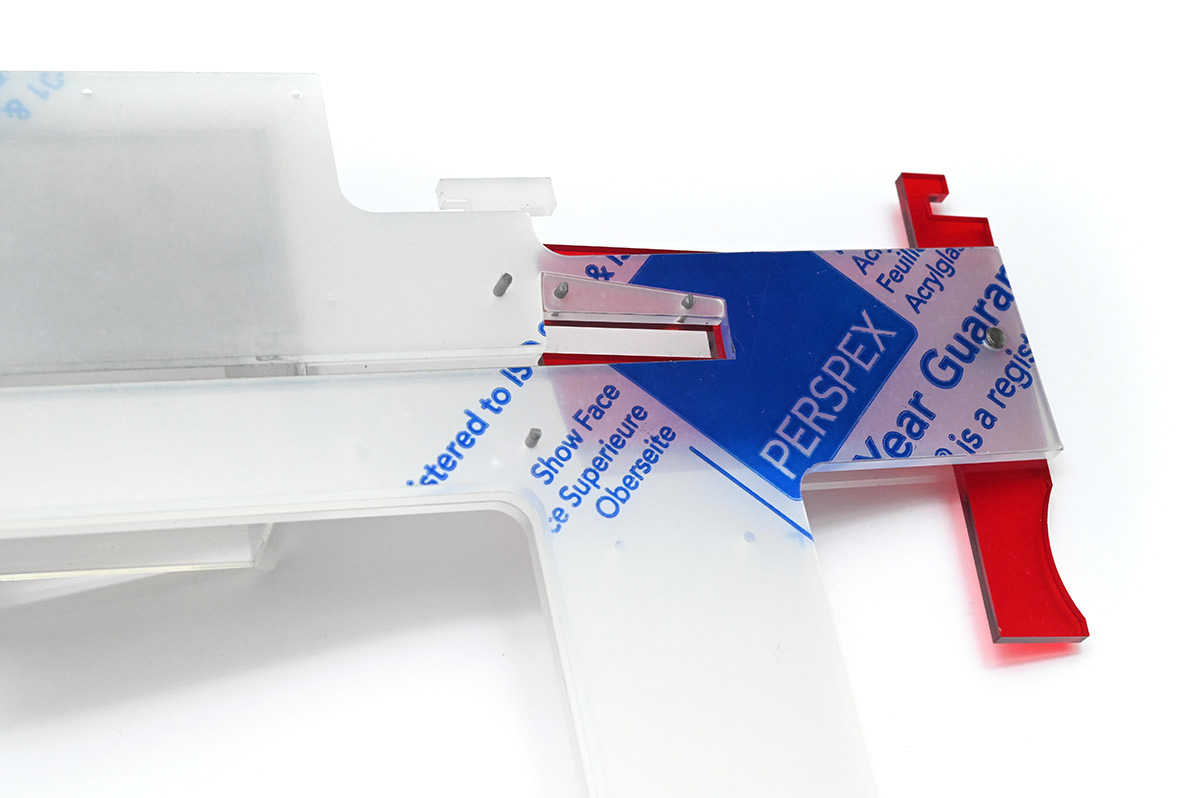 Close view of screw dispensing mechanism, open