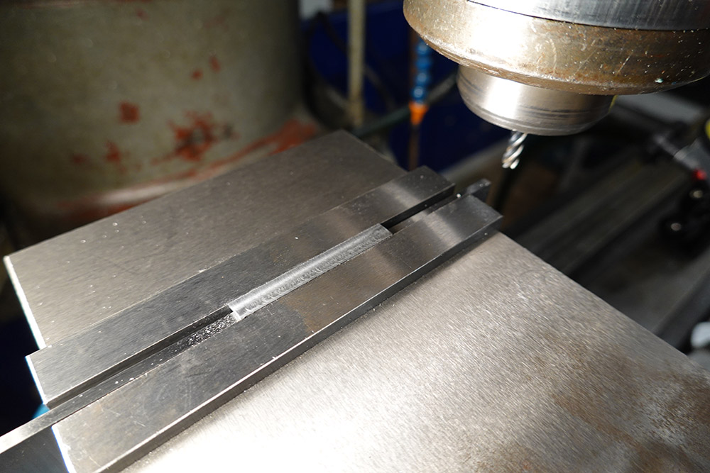 A small strip of metal held in the milling vice