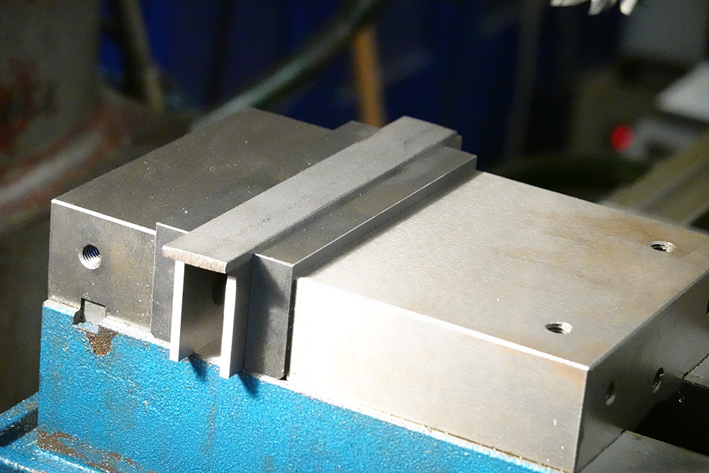 The steel stock in the clamped carefully in the milling vice