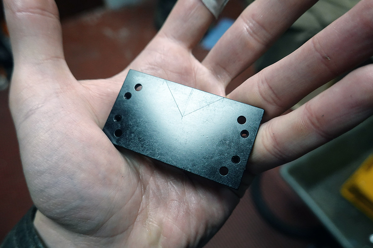 Thin metal plate with V-cutout scribed