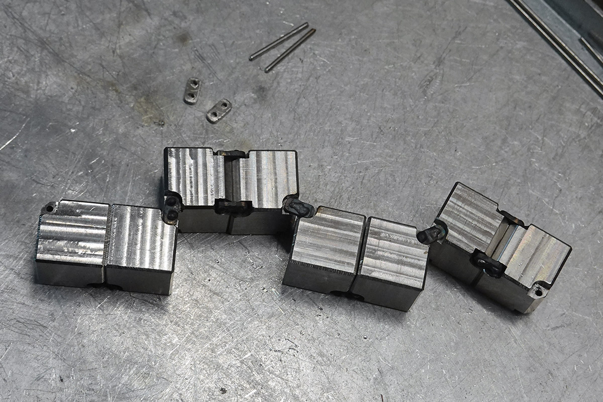 Eight cubes with hinges linking them into a line