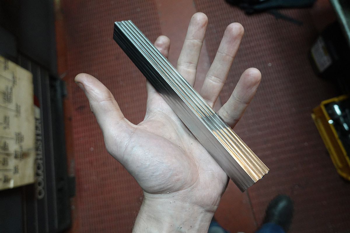 Bar fully squared up, with stripey machining patterns on it