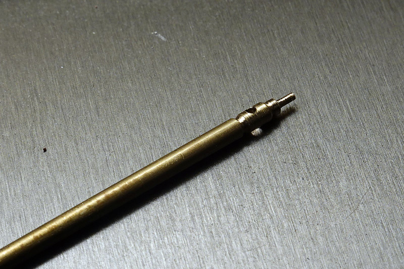 Closeup of the cross drilled brass