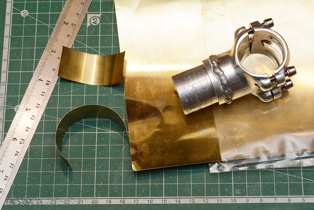 Brass shim stock cut into a sections and the dismantled stem