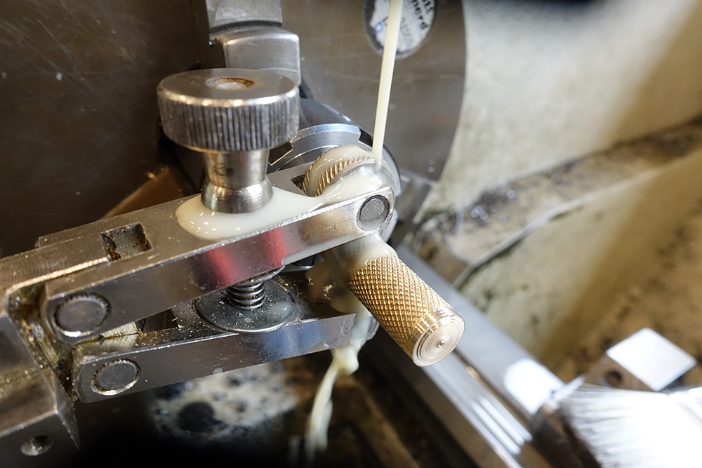 The knurling tool in action, with flood coolant