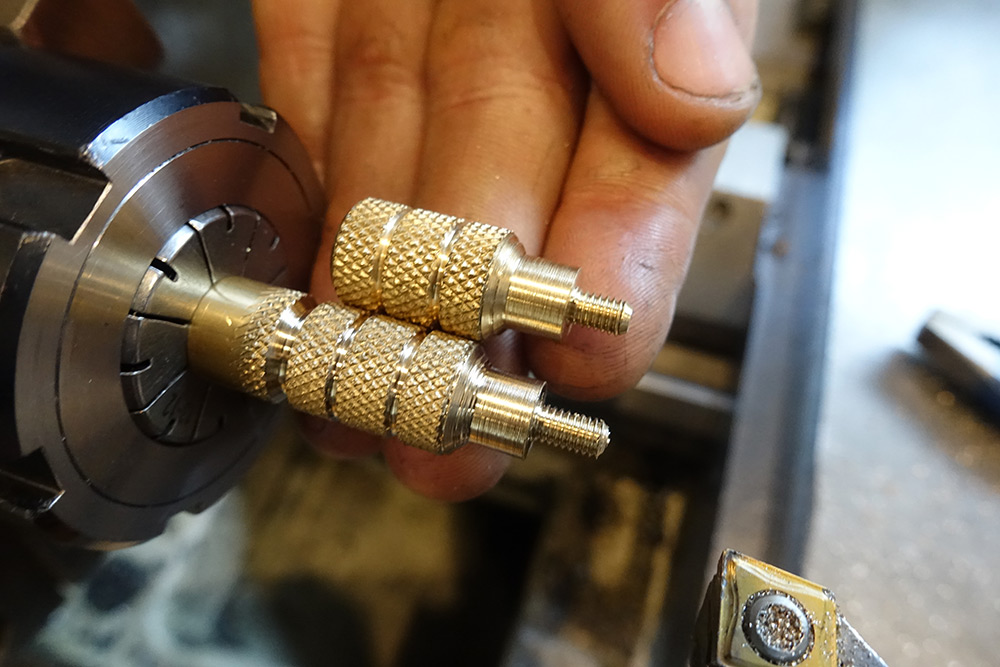 Comparing a half finished knurled knob to a completed one