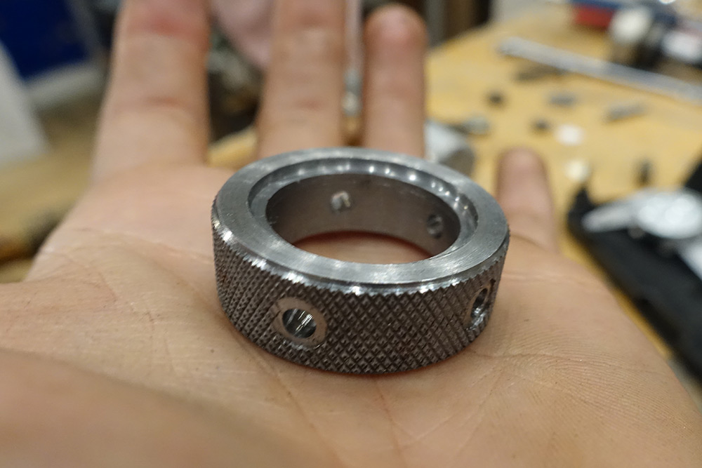 The knurled steel ring with holes drilled